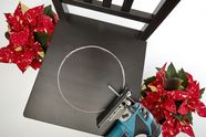 Chair with circle drawn, jigsaw and two poinsettias